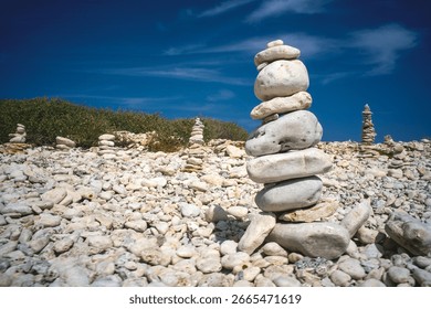 stack of pebbles balanced on the rocky coast of the island of Oléron