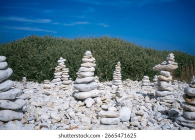 stack of pebbles balanced on the rocky coast of the island of Oléron