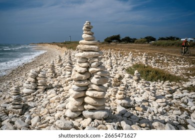 stack of pebbles balanced on the rocky coast of the island of Oléron