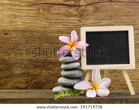 stack of pebbles and a mini blackboard