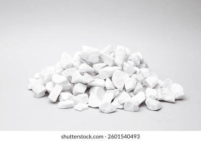 Stack of pebbles on a gray background