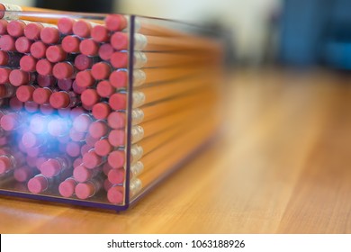 Stack of Pencils in Plastic Clear Container 