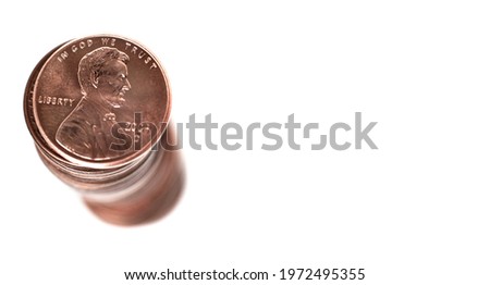 Stack of pennies isolated on white background representing savings wealth and investing