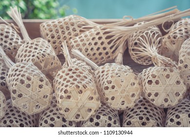 Stack or pile of brown round bamboo market in wooden tray. (Selective focus)