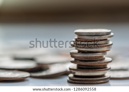 Stack and piles of coins
