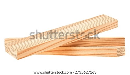 Stack of pine wood planks isolated on a white background. Natural rough wooden boards, lumber, timber. Industrial wood.