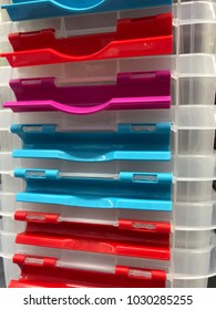 A Stack Of Plastic Storage Boxes