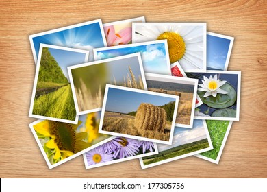Stack of printed pictures collage on wooden table