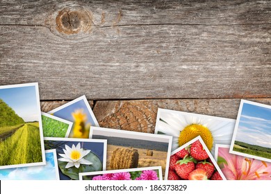 Stack of printed pictures collage on wooden table with copy space for your text or photo