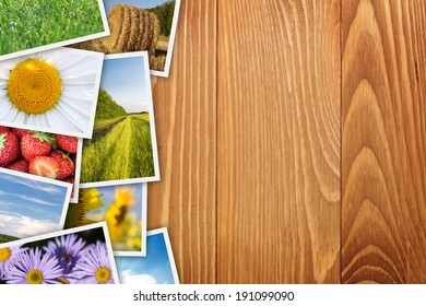 Stack of printed pictures collage on wooden table with copy space for your text or photo
