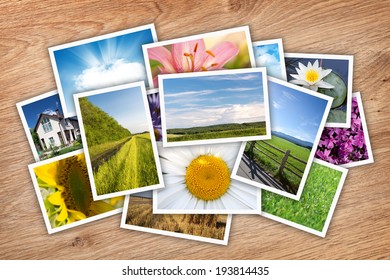 Stack Of Printed Pictures Collage On Wooden Table