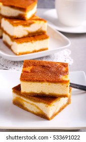 Stack Of Pumpkin Cheesecake Bars On Plate