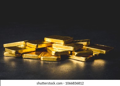 Stack Of Pure Gold Bars On Black Background