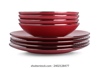 Stack of red bowls and plates isolated on white