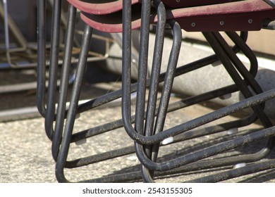 stack of red chairs outside at school