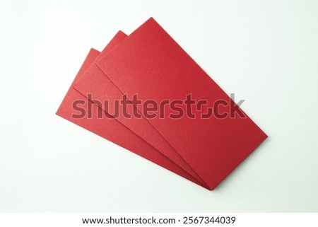 Stack of red envelopes gift isolated on white background. Concept for Chinese New Year. Empty blank copy text space. Mock up - cut out image.