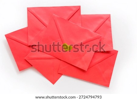 Stack of red paper envelopes with heart seal on white background. Suitable for Valentines Day campaigns, romantic messaging, greeting cards, email marketing visuals and social media posts. High quality photo
