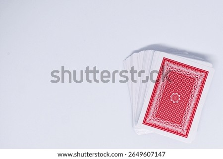 stack of red playing cards isolated on white background
