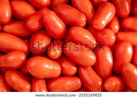 Stack of red plum tomatoes