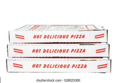 Stack of red and white pizza boxes. White background. Horizontal.