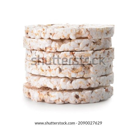 Stack of rice crackers on white background