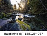 Stack of Rocks by the beautiful river in Canadian Nature during winter. Taken in Brandywine Falls, near Whistler and Squamish, North of Vancouver, BC, Canada.