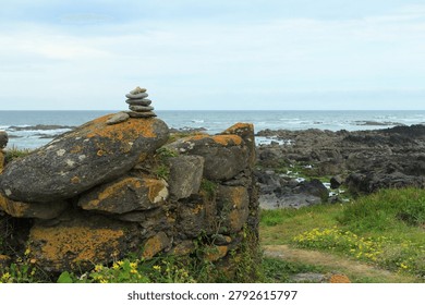A stack of rocks on a rocky beach