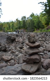 A stack of rocks, otherwise known as a cairn. Each stone is meticulously placed so they perfectly balance each other out. Gooseberry Falls State Park. 
