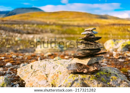 Stack Of Rocks Stones On Norwegian Mountain, Norway Nature. Toned Instant Photo