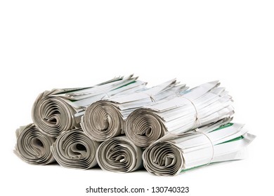 A stack of rolled up newspapers ready to be delivered