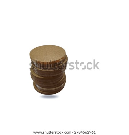 Stack of round brown acrylic blanks with protective paper material for crafting and laser engraving, isolated on white background.