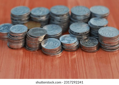 a stack of rupiah coins, indonesian currency - Shutterstock ID 2317292241