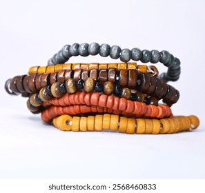 Stack of Rustic Beaded Bracelets - Natural Tones and Textures Isolated on a white background