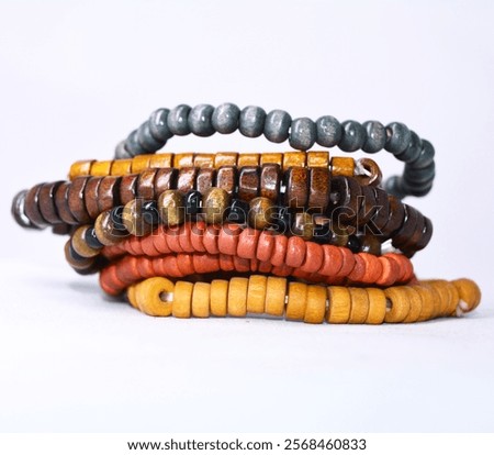 Stack of Rustic Beaded Bracelets - Natural Tones and Textures Isolated on a white background