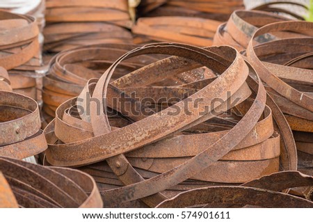 A stack of rusty barrel hoops at a cooperage in Dufftown, Scotland