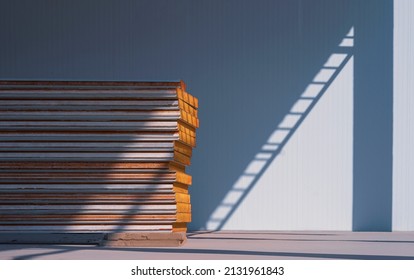 Stack Of Sandwich Panels On The Floor With Sunlight And Shadow On Surface Of Cold Storage Room In Freezer Warehouse Industry Area