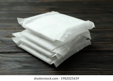 Stack Of Sanitary Pads On Wooden Background