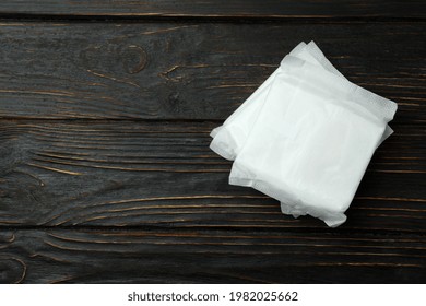 Stack Of Sanitary Pads On Wooden Background