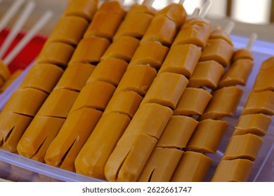 stack of sausages ready to be grilled. Sausage is a processed meat product made from ground meat, usually pork, beef, fish, or poultry.
