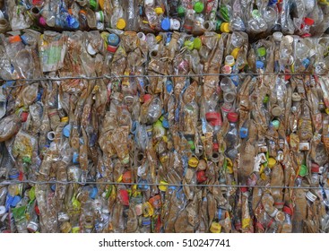 Stack of scrap old plastic bottles, Plastic garbage, Crushed PET bottles for recycle, soft focused.