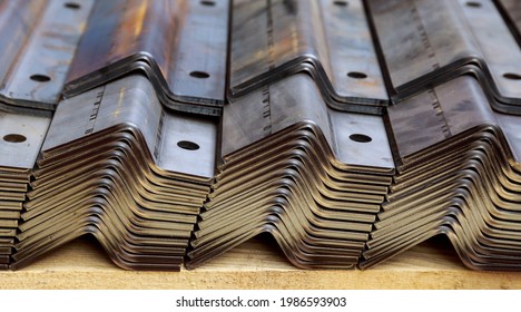 A stack of sheet metal products after processing on a bending machine.