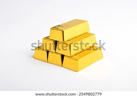 Stack of shiny gold bars isolated on white background