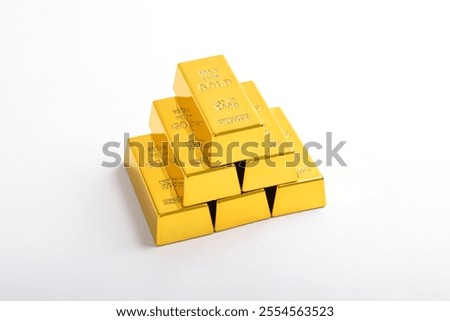Stack of shiny gold bars isolated on white background