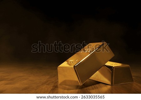 Stack of shiny gold bars on dark brown wooden floor background