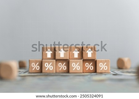 Stack of silver coins with up arrow. Finance concept increase interest rate or dividend investment mortgage. Stock market chart for bank. Business growth, profit, long term investment.