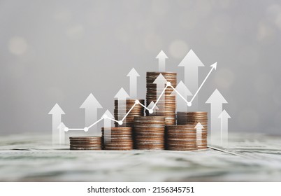 stack of silver coins with trading chart in financial concepts and financial investment business stock growth - Shutterstock ID 2156345751