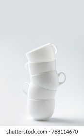 stack of six white cups isolated on white