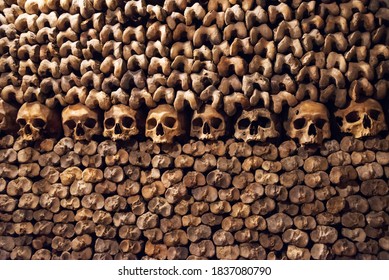 Stack of skulls and bones in the catacombs of Paris, France