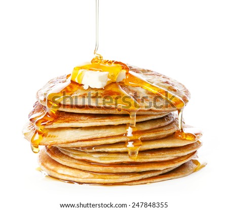 Stack of Small pancakes in syrup on white background