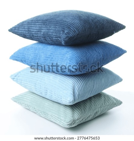 Stack of soft color cushions isolated on white